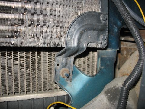 1995 Ford C-350 (Centurion Conversions) - Close-up of the intercooler mounting bracket on a 1995 Ford C-350 (Centurion Conversions) showing its connection to the radiator and body p…
