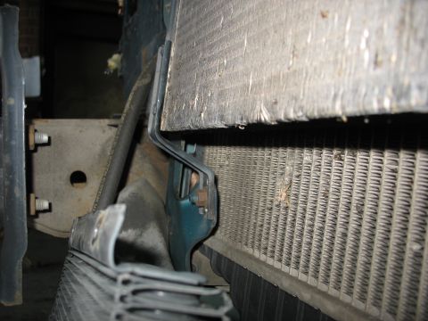1995 Ford C-350 (Centurion Conversions) - Detail view of the front of a vehicle, focusing on the cooling system components.