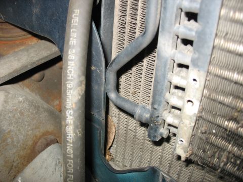 1995 Ford C-350 (Centurion Conversions) - Detail of an intercooler and a fuel line with visible text indicating its size and purpose.