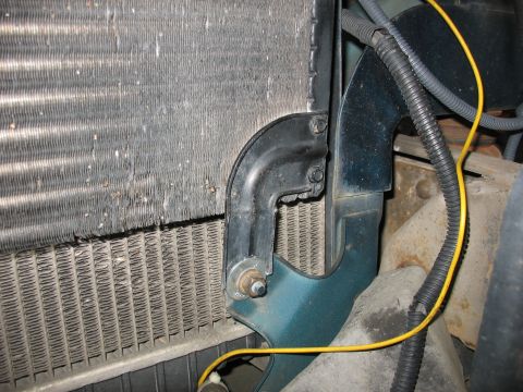 1995 Ford C-350 (Centurion Conversions) - Close-up view of the vehicle's radiator and intercooler, showing wiring and mounting brackets.