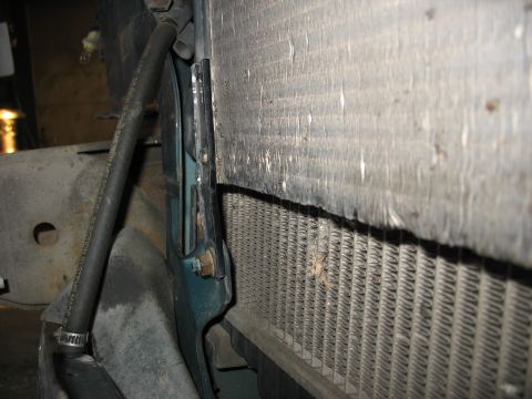 1995 Ford C-350 (Centurion Conversions) - Close-up view of the intercooler and radiator assembly, showing hoses and mounting brackets.