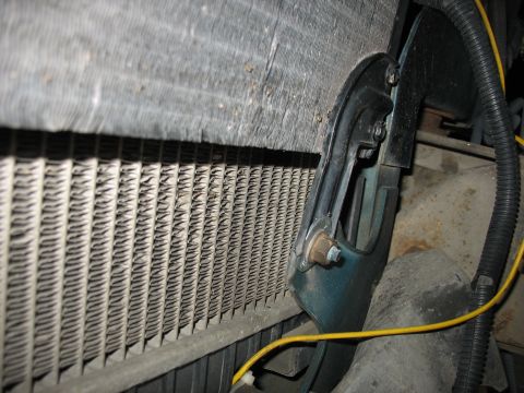 1995 Ford C-350 (Centurion Conversions) - Close-up view of a vehicle's radiator and intercooler assembly, showing the fins and mounting hardware.