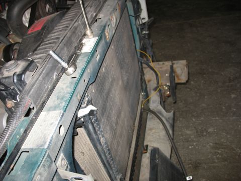 1995 Ford C-350 (Centurion Conversions) - Close-up of a vehicle's engine bay, focusing on the radiator and surrounding components.