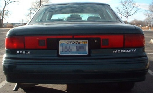 Rear of dark green Mercury Sable with SABLE and MERCURY badges and Nevada plate