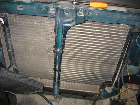 1995 Ford C-350 (Centurion Conversions) - Radiator and intercooler assembly with mounting bracket. A wrench is on top.