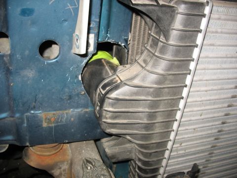 1995 Ford C-350 (Centurion Conversions) - Close-up view of intercooler piping and radiator installation on a blue vehicle.