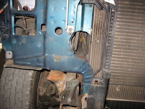 1995 Ford C-350 (Centurion Conversions) - Close-up view of intercooler piping and radiator in a vehicle's engine bay.