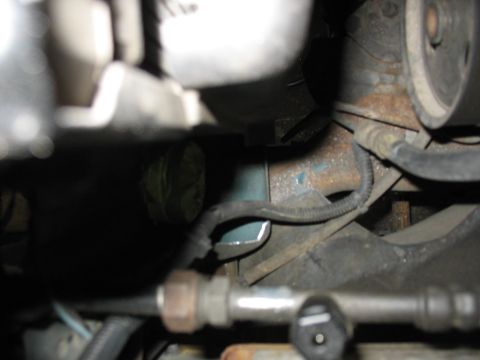 1995 Ford C-350 (Centurion Conversions) - Engine bay components including hoses and wiring, with visible rust on metal parts.