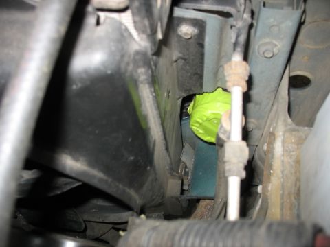 1995 Ford C-350 (Centurion Conversions) - Close-up view of an engine bay, showing a component covered in bright green tape.