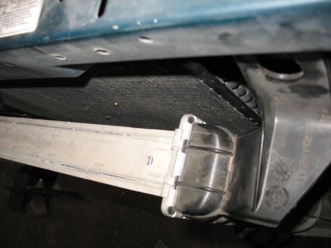 1995 Ford C-350 (Centurion Conversions) - Intercooler piping and mounting bracket with plastic housing visible.
