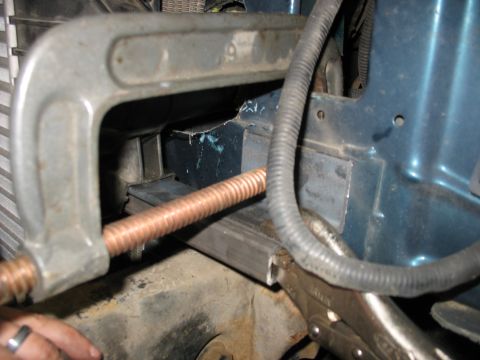 1995 Ford C-350 (Centurion Conversions) - Modifying engine bay with clamp and vise grips on a copper pipe.