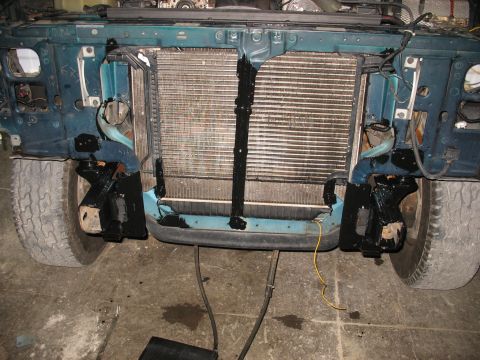 1995 Ford C-350 (Centurion Conversions) - The front end of a vehicle is shown with the radiator and intercooler exposed, indicating recent work or modification.