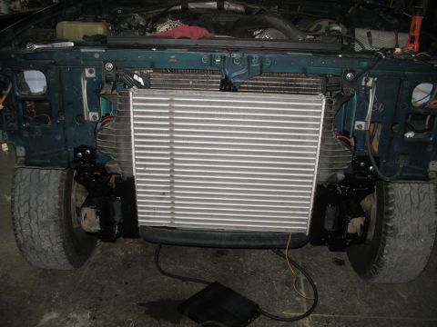 1995 Ford C-350 (Centurion Conversions) - The front of a truck is shown with a large intercooler installed, obscuring the original radiator.