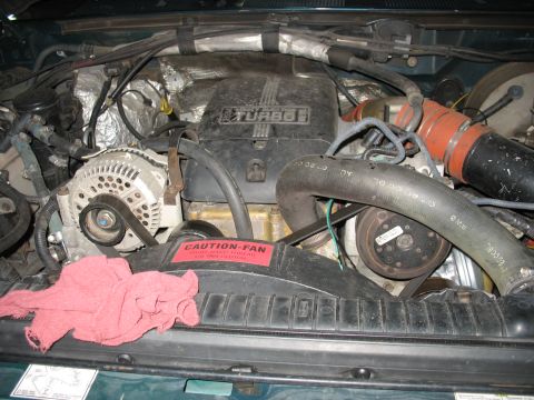 1995 Ford C-350 (Centurion Conversions) - Close-up view of the engine compartment, highlighting the turbo and cooling system components.