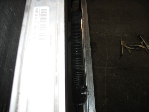 1995 Ford C-350 (Centurion Conversions) - A black intercooler hose is visible next to a metal frame with a label containing a barcode.