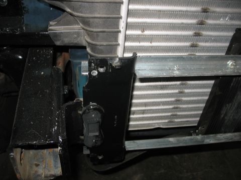 1995 Ford C-350 (Centurion Conversions) - Detail of the intercooler and radiator assembly, with visible mounting hardware and fins.