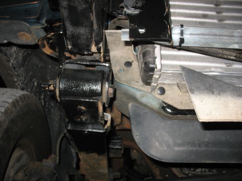 1995 Ford C-350 (Centurion Conversions) - The intercooler and associated plumbing are visible, mounted to the vehicle's frame.