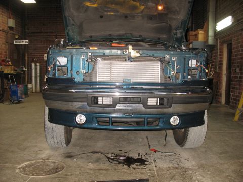 1995 Ford C-350 (Centurion Conversions) - Front view of a 1995 Ford C-350 (Centurion Conversions) with the hood up, showing the radiator.
