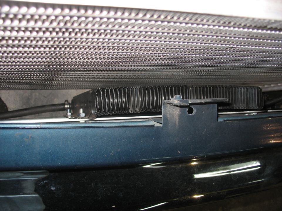 Close-up of an intercooler unit mounted below a vehicle's radiator