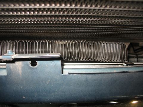1995 Ford C-350 (Centurion Conversions) - The image shows the fins of an intercooler and a radiator, likely from a vehicle's engine bay.