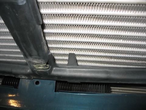 1995 Ford C-350 (Centurion Conversions) - Close-up view of an intercooler with visible fins and mounting hardware.