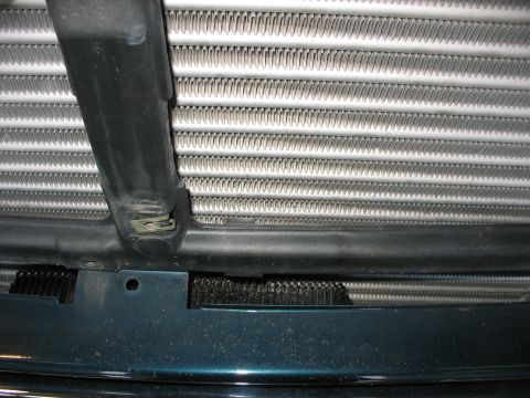 1995 Ford C-350 (Centurion Conversions) - View of the intercooler assembly, showing its finned structure and surrounding mounting components.