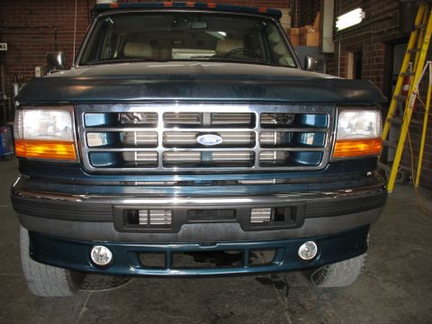 1995 Ford C-350 (Centurion Conversions) - 1995 Ford C-350 (Centurion Conversions) front view, showing grille and bumper details.