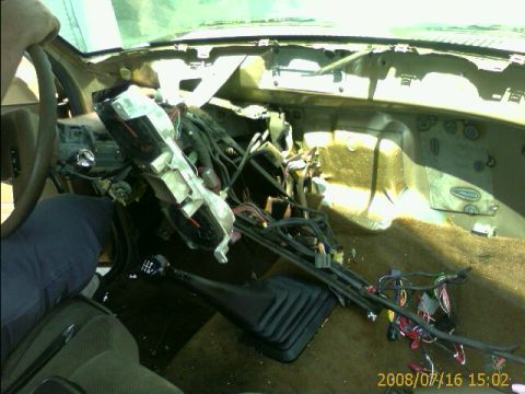 1990 Ford Bronco - interior of a Ford truck with the dashboard pulled forward and wiring harness hanging loose during disassembly, date-stamped 2008/07/16.
