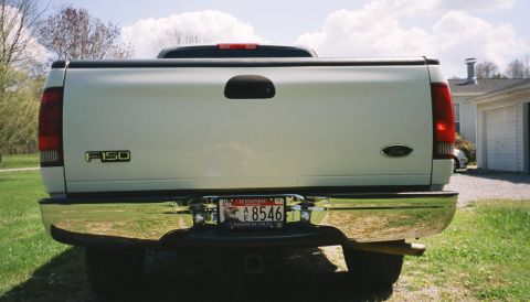 2007 Ford Mustang - The rear of a white Ford F-150 pickup truck is shown with a chrome bumper and a Tennessee license plate.