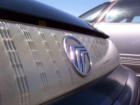 1995 Mercury Sable - Front lightbar and Mercury logo after I polished the yellow out! It looks so much better.