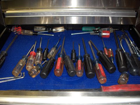 2007 Ford Mustang - A collection of various screwdrivers is neatly organized within a tool drawer.