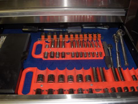 2007 Ford Mustang - A collection of sockets and ratchets organized in a tool drawer.