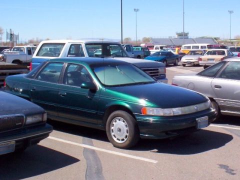 1995 Mercury Sable - Front-angle of the car parked. That's a Magic Shade in the windshield if you're wondering.