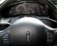 2007 Ford Mustang - Interior view of a Lincoln vehicle, showing the dashboard, gauges, and steering wheel.