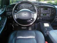 2007 Ford Mustang - The interior of a car, showing the dashboard, steering wheel, and center console controls.