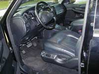 2007 Ford Mustang - Interior view of a car's front seats and dashboard.