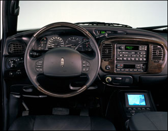 2007 Ford Mustang - Interior view of a Lincoln Navigator, displaying the dashboard controls and driver's area.