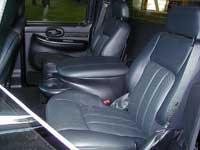 2007 Ford Mustang - The interior of a truck, showing the front seats and console area.
