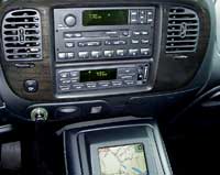 2007 Ford Mustang - Vehicle interior with navigation screen and audio system controls visible.