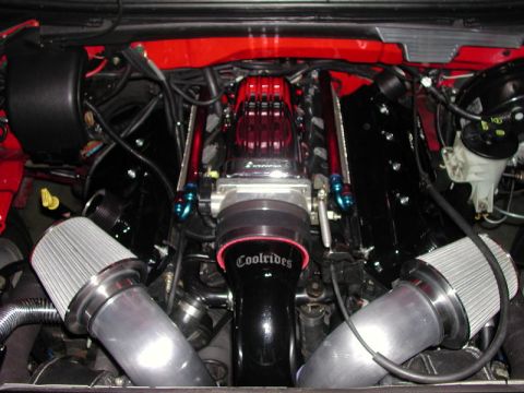 2007 Ford Mustang - Customized engine bay with prominent "Coolrides" branding on the intake system.