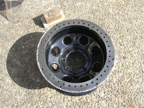 1996 Ford Bronco - Aftermarket wheel with holes around the rim, possibly for a beadlock.