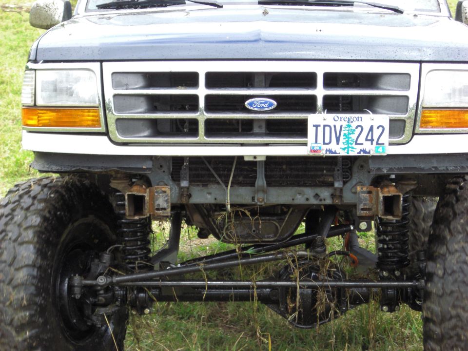 Dark blue 1992 Ford Bronco front grille and suspension with large tires