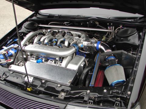 1992 Ford Taurus - Customized engine bay a 24 valve DOHC engine with aftermarket intake and air filters.