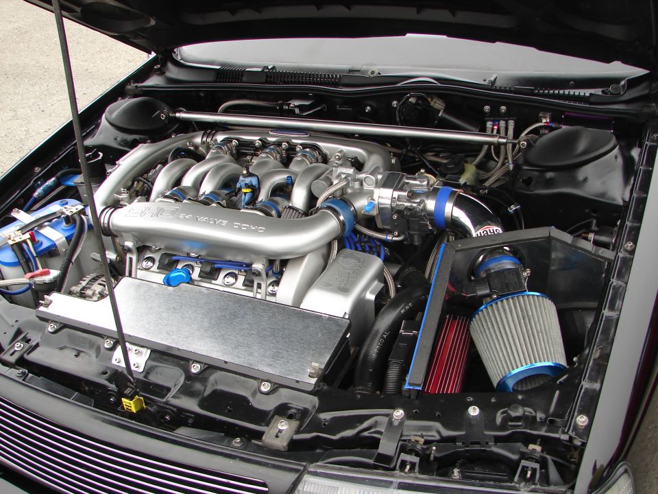 Engine bay with custom intake and 24 valve DOHC engine
