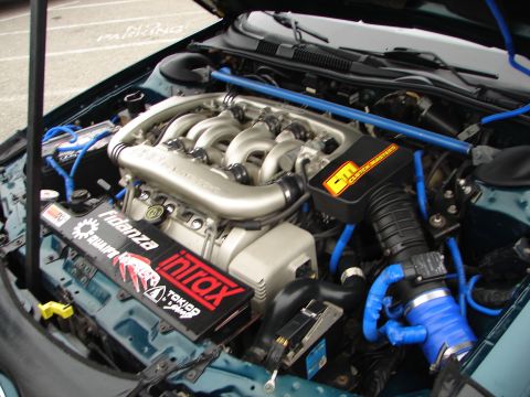 1992 Ford Taurus - Engine bay modifications visible, including custom intake and performance parts.