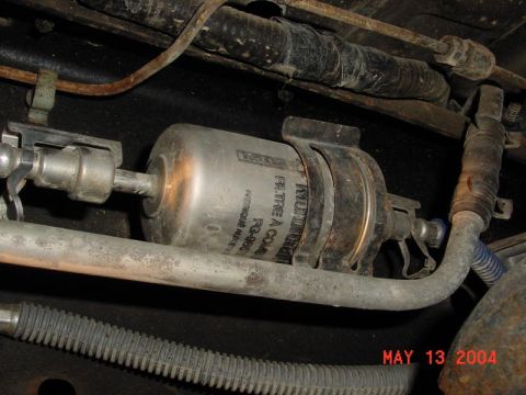 2007 Ford Mustang - A vehicle's fuel filter is shown, with a date stamp of May 13, 2004 visible.