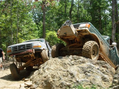 1995 Ford Bronco - Two Ford Broncos tackle a challenging rocky trail during an off-road excursion.