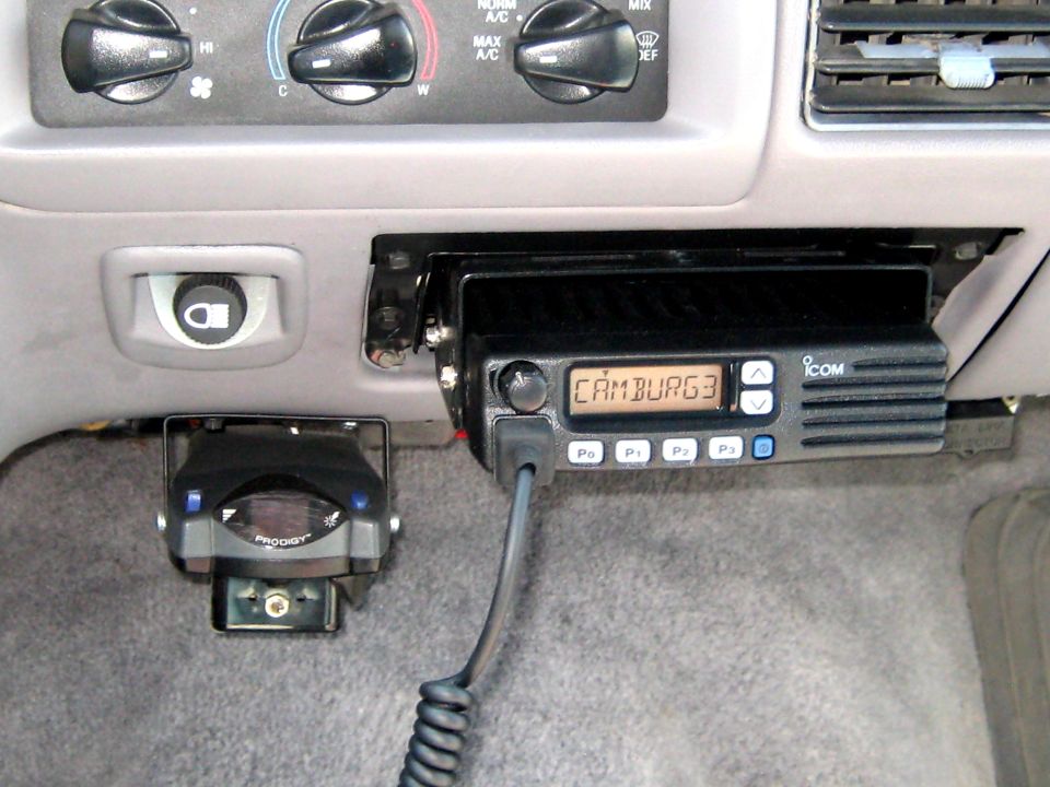 Dashboard with ICOM radio and Prodigy brake controller. Radio display shows CAMBURG3