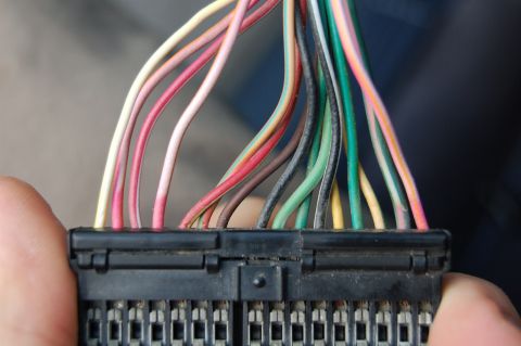1985 Mercury Grand Marquis - Wiring harness connector with numerous colored wires, likely for automotive electronics.