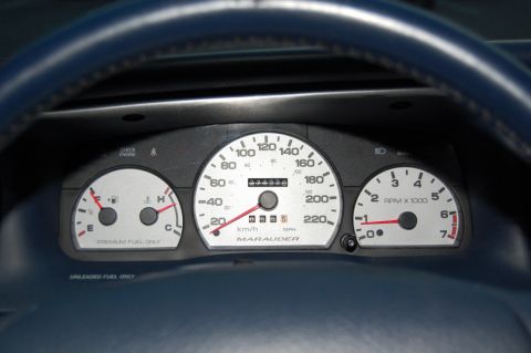 1985 Mercury Grand Marquis - Dashboard gauges including speedometer, tachometer, and fuel gauge are visible.